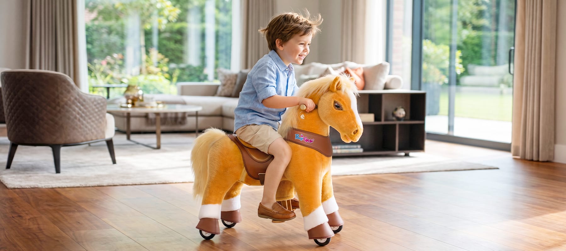 child bouncing in the saddle as a ride-on horse toy moves forward